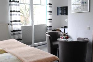 Postel nebo postele na pokoji v ubytování Hotel Garni Nolting
