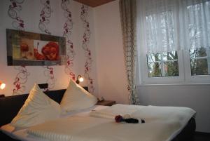 Postel nebo postele na pokoji v ubytování Hotel Garni Nolting