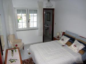 Cama o camas de una habitación en Apts Playa Monte Pindo