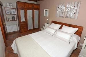 A bed or beds in a room at Casa Maday