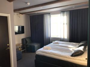 Postel nebo postele na pokoji v ubytování Hotell Gamla Staden