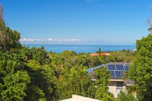 a view of the ocean from a house at Kilala - executive home in Port Macquarie