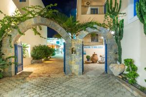 an entrance to a building with an archway at Nana Angela Apartments in Hersonissos