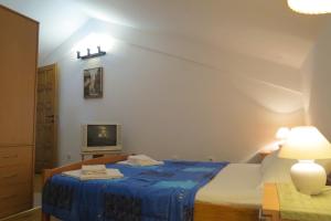 Voodi või voodid majutusasutuse Apartments Vuković toas