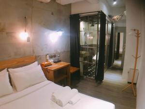 Postel nebo postele na pokoji v ubytování Just Inn 正旅館 台北車站