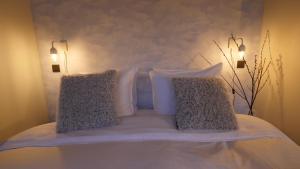 Een bed of bedden in een kamer bij Hotel in het huis van Deventer