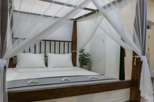 Postel nebo postele na pokoji v ubytování Villa Rosa Blanca