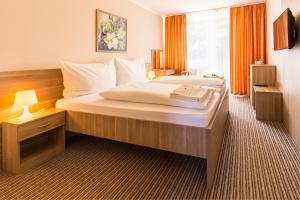 Posteľ alebo postele v izbe v ubytovaní Bed & Breakfast Hotel Perla