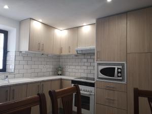 Kuchyňa alebo kuchynka v ubytovaní La casa del barrio