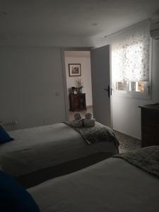 Posteľ alebo postele v izbe v ubytovaní La casa del barrio
