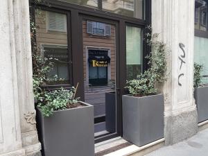 The facade or entrance of Domus Navigli