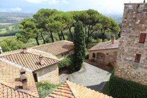 an aerial view of a house with trees and roofs at Borgo La Torre alle Tolfe in Siena +154 photos