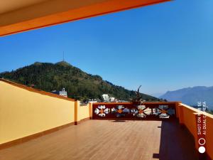 a balcony with a view of a mountain at Quoc Thai Sapa Hotel in Sa Pa