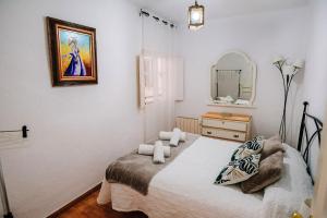 מיטה או מיטות בחדר ב-Los Morales de Granada