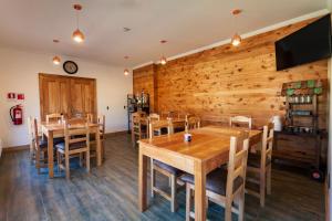 TV a/nebo společenská místnost v ubytování Hostal Boutique Patagonia Mística