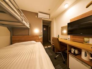 Super Hotel Mihara Ekimae客房内的一张或多张床位