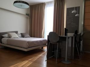 Corso Como New Building Apartment tesisinde bir odada yatak veya yataklar