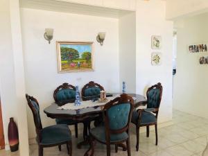 a dining room with a table and chairs at Opp Sea, Beach, Restaurants 5b - 2bed 2 bath 5B Hastings Tower in Bridgetown