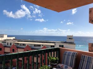 a view of the ocean from a balcony at Opp Sea, Beach, Restaurants 5b - 2bed 2 bath 5B Hastings Tower in Bridgetown