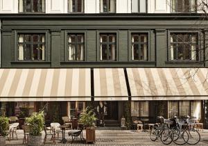 
a row of bikes parked in front of a building at Hotel Sanders in Copenhagen
