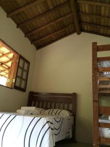 Postel nebo postele na pokoji v ubytování Canto do Riacho Suites