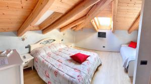 En eller flere senge i et værelse på Il Bambuseto