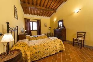 Postel nebo postele na pokoji v ubytování Agriturismo Pratovalle