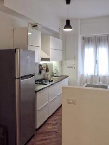 A kitchen or kitchenette at New Capolinea 5 - Apartment