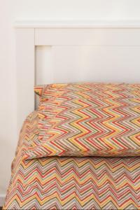 A bed or beds in a room at New Capolinea 5 - Apartment