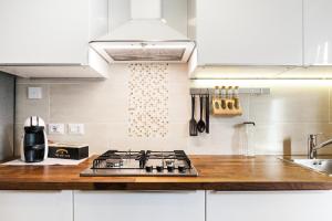 A kitchen or kitchenette at New Capolinea 5 - Apartment