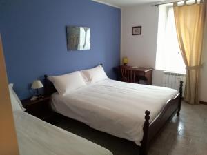 Postel nebo postele na pokoji v ubytování albergo ristorante coppa