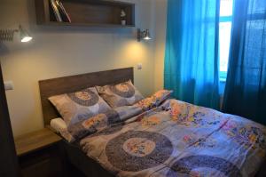 Posteľ alebo postele v izbe v ubytovaní Apartament WILDA