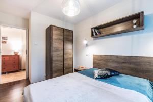 Łóżko lub łóżka w pokoju w obiekcie Apartament WILDA