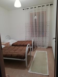 Ένα ή περισσότερα κρεβάτια σε δωμάτιο στο Appartamento San Valentino