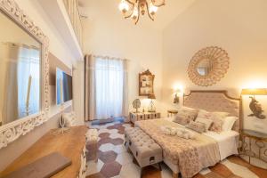 A bed or beds in a room at QuattroCuori Boutique Hotel & Spa