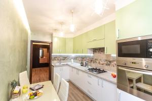 Kuchyňa alebo kuchynka v ubytovaní Delicate Lviv Apartment