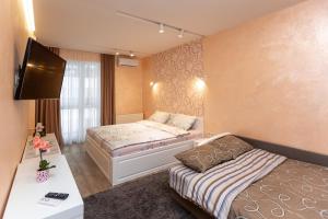Posteľ alebo postele v izbe v ubytovaní Delicate Lviv Apartment