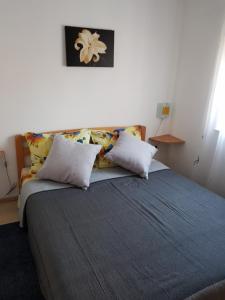 Postel nebo postele na pokoji v ubytování Apartments Davor