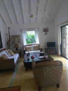 a living room with a couch and a table at Casa Blanca in Las Terrenas