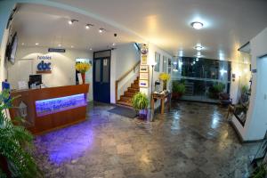 a lobby of a building with a staircase and a lobby at La Casa de Fray Bartolome in Cusco