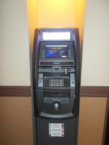 a parking meter with a remote control on top of it at AmericInn by Wyndham Aberdeen Event Center in Aberdeen