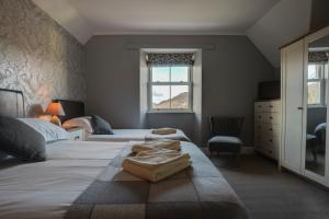 Ένα ή περισσότερα κρεβάτια σε δωμάτιο στο Lyndale Guest House