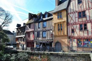 a group of buildings in a town with a bridge at STUDIO COCON ULTRA CENTRE LE MANS in Le Mans