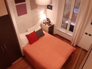A bed or beds in a room at 111 ColaDiRienzo Rooms - by AD Roma
