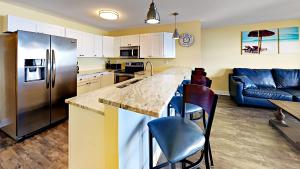 A kitchen or kitchenette at Put-in-Bay Waterfront Condo #109