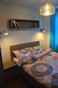 Posteľ alebo postele v izbe v ubytovaní Apartament WILDA