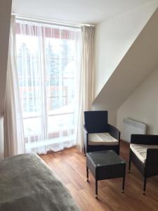 Postel nebo postele na pokoji v ubytování Apartmán Říčky 23 + 32 fotografií