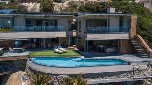 an aerial view of a house with a swimming pool at Beach Music in Llandudno
