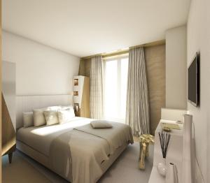 Un dormitorio con una cama grande y una ventana en Le Malown, en París