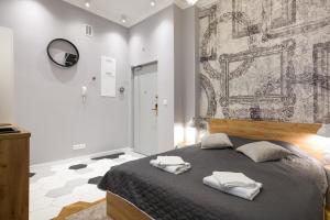 En eller flere senge i et værelse på Welcome Apartment - Old Town